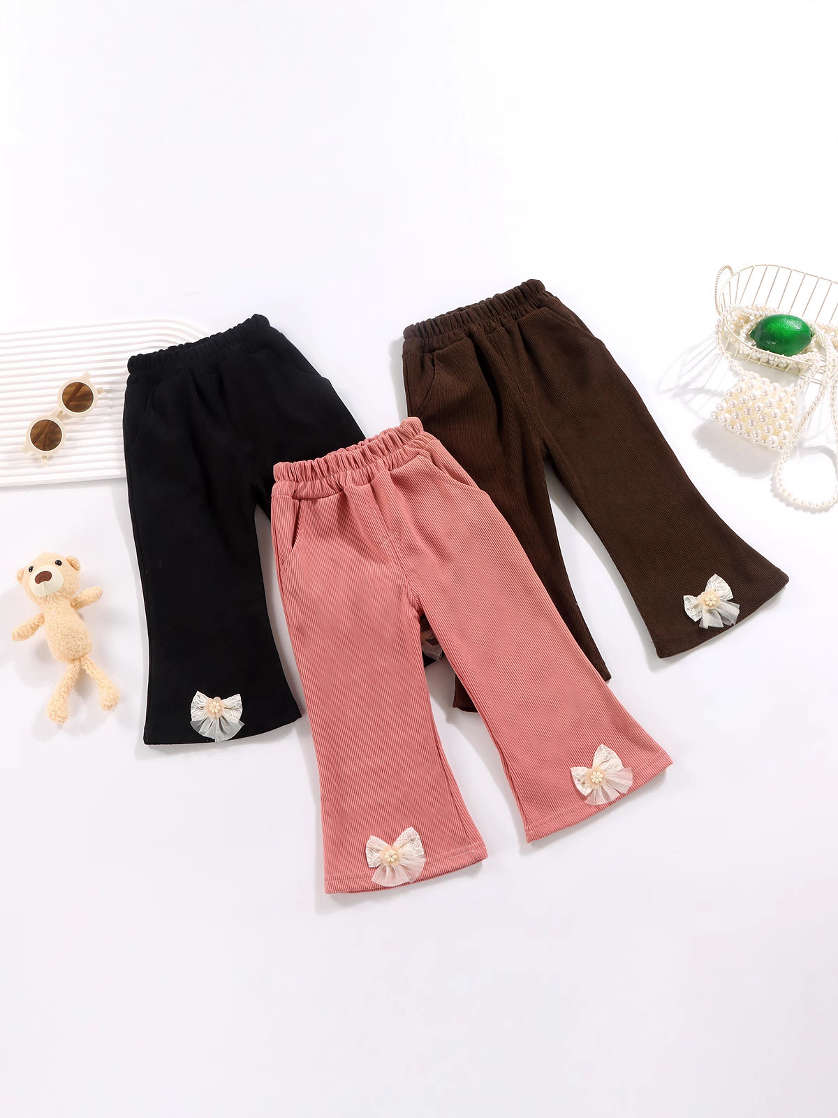 Universal autumn corduroy flared trousers with bow