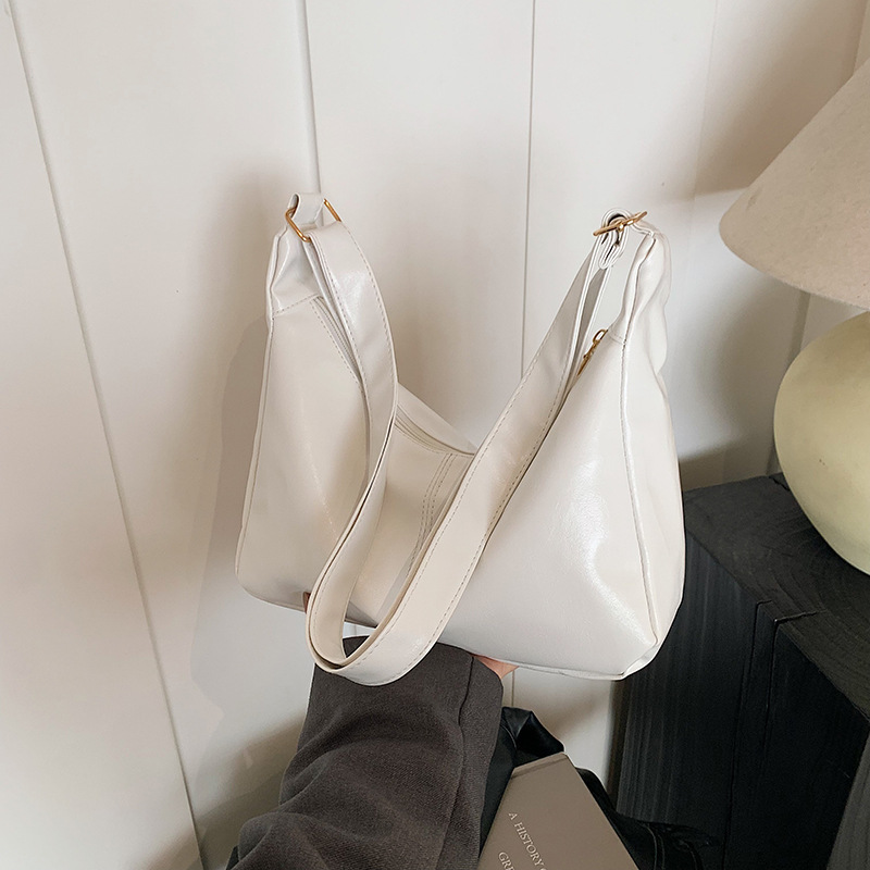 Color sólido textura de cuero suave hombro mochila para mujeres 2025 primavera nueva literatura y arte bolsos casuales bolsos especiales de moda