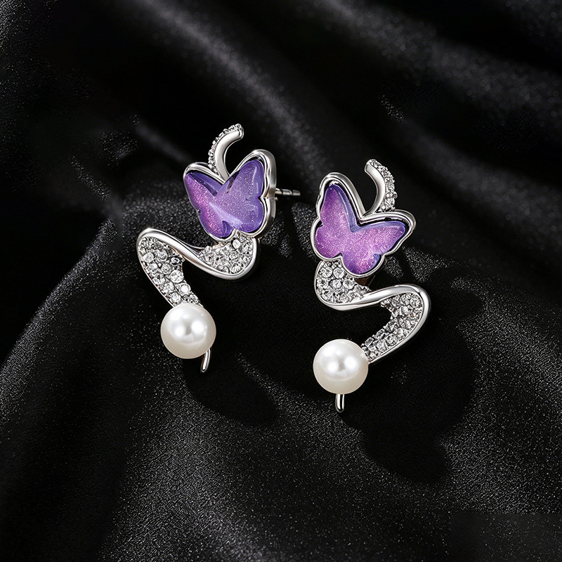Xuping gemas artificiales de piedra moca mariposa pendientes de nicho femenino diseño de viento dulce perla pendientes de orejas
