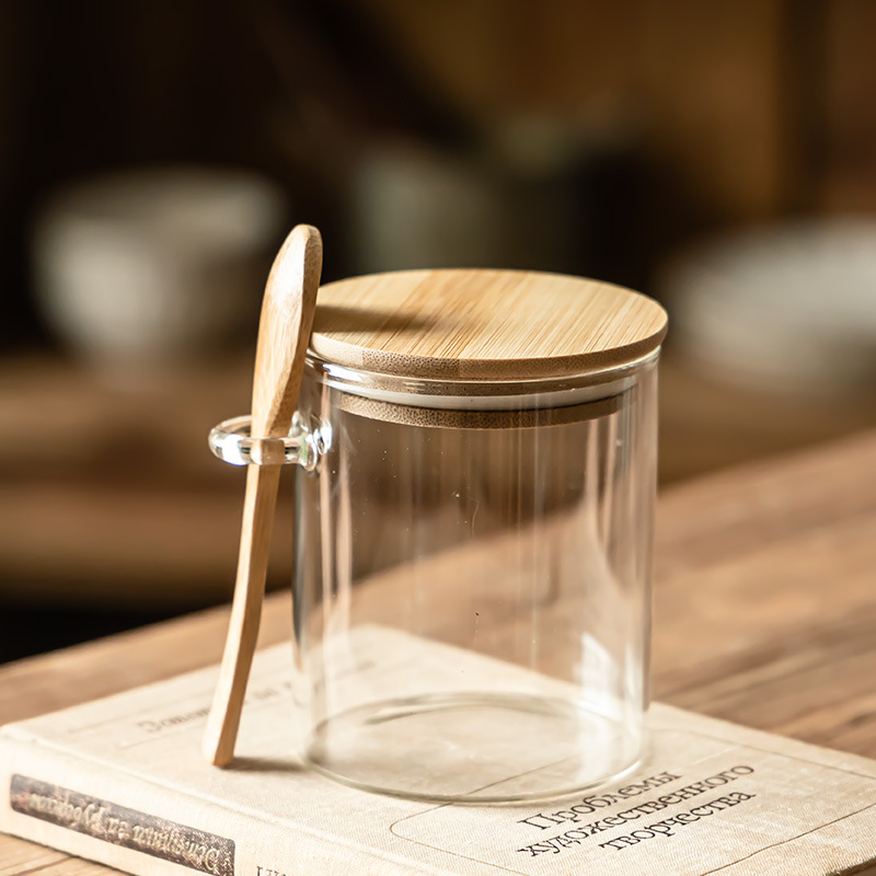 Hogar con cuchara, tanque de almacenamiento, frasco de bocadillos a prueba de humedad, tanque de té, tanque de almacenamiento de cocina transparente con tapa al por mayor