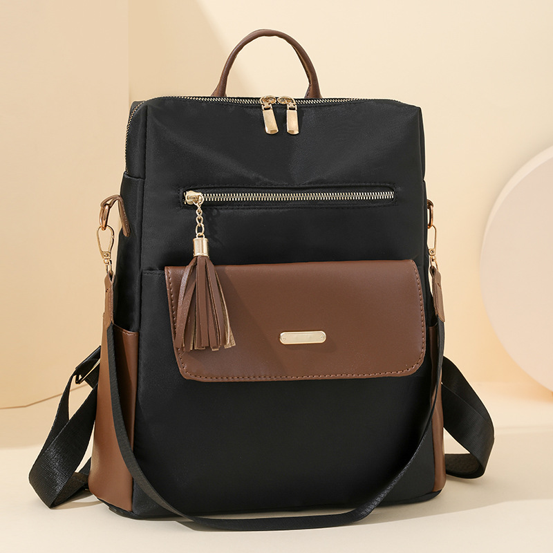 Mochila de tela de nailon nueva transfronteriza para mujer, bolso de viaje de ocio ligero y versátil de gran capacidad, mochila con flecos