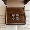 Earrings with zircon with bow
