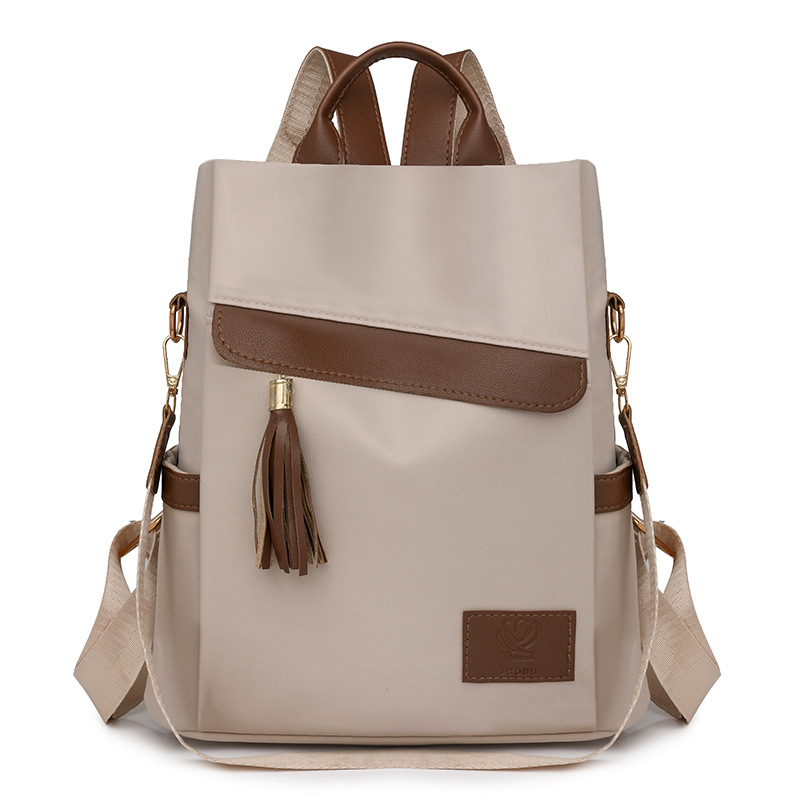 2024 otoño, nueva mochila antirrobo para mujer, borla de moda, color de contraste, nailon, mochila de viaje, mochila escolar, marea