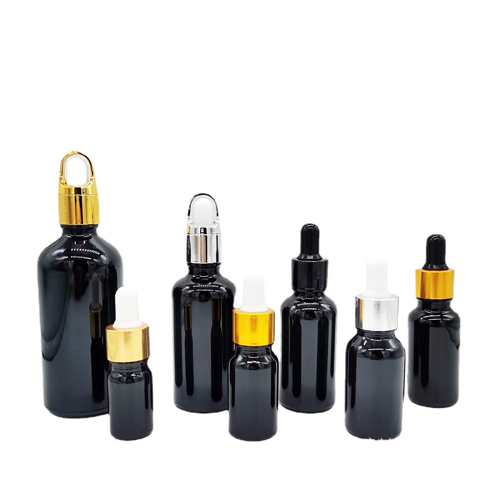 En stock botella de aceite esencial de vidrio negro brillante 5mL-100mL materia prima cosméticos negros sub-botella sombreado botella cuentagotas de cabeza de goma