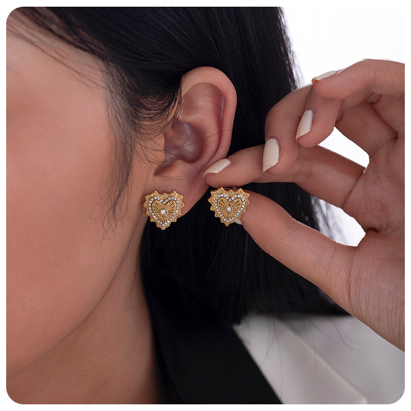 Taina europa 18k oro verdadero electro galvanizado de acero de moda viento de viaje irradiando luz amor aretes de acero inoxidable al por mayor