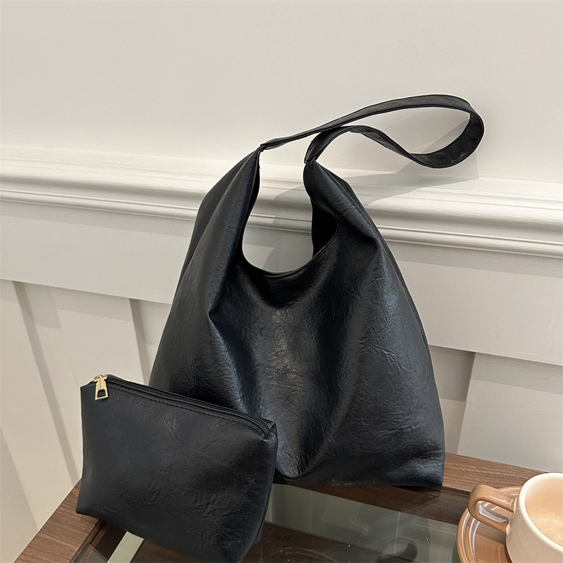 Bolso coreano de invierno para mujeres 2024 bolso de viaje de alta calidad sensación de gran capacidad simple versátil bolso de hombro de cuero suave