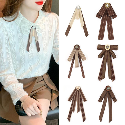 Lapel blouse with a British academic style, coffee brown color, featuring a vintage butterfly bow tie, collar flowers, and a pin accessory.