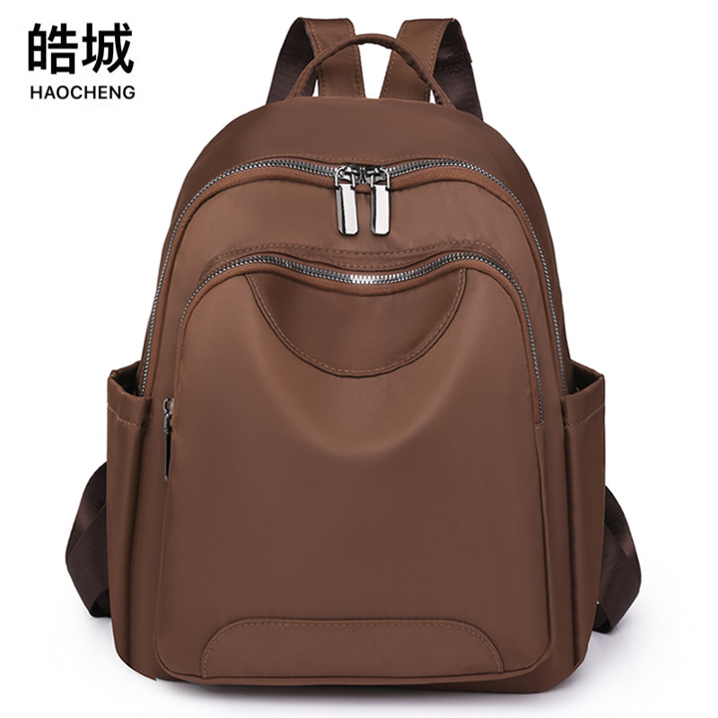 Fábrica al por mayor 2023 nueva mochila de nailon para mujer coreana simple mochila de viaje urbano mochila escolar de moda