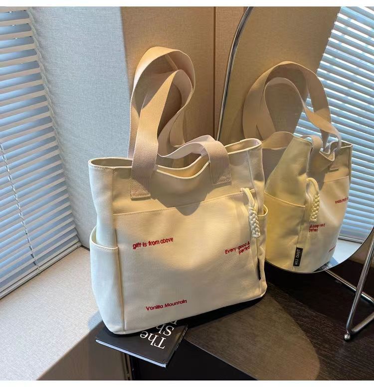 Bolsa de mano ligera para mujeres en clase de hombro único bolso de lienzo con cremallera de estilo coreano