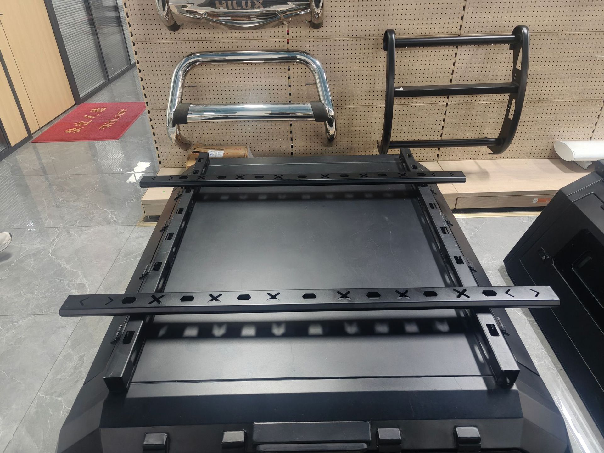 Specialized black metal roof rack for pickup truck bed modification with guardrail protection design