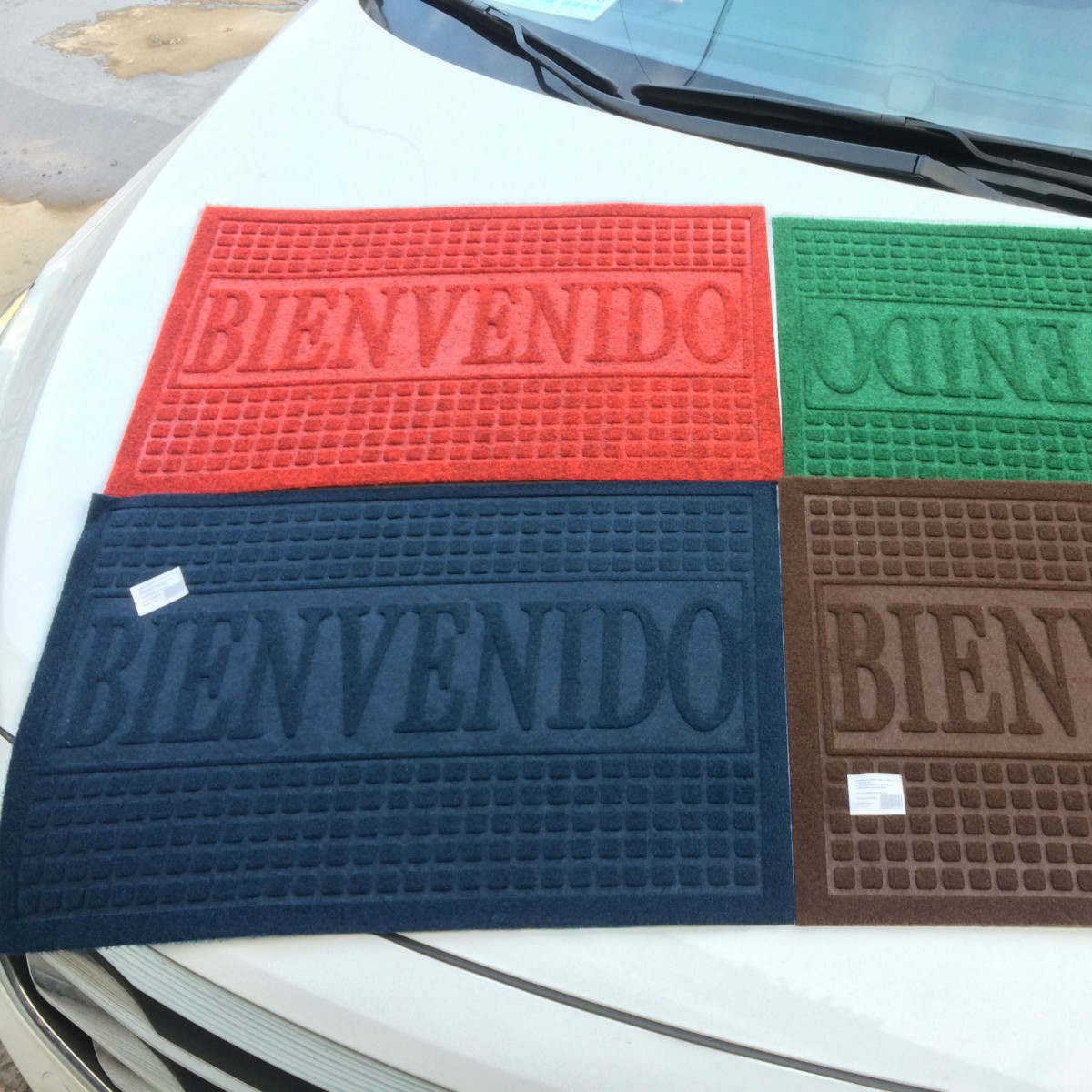 Fábrica directa de exportación barata de comercio exterior español estirado esteras en relieve ventas calientes alfombras de piso de entrada