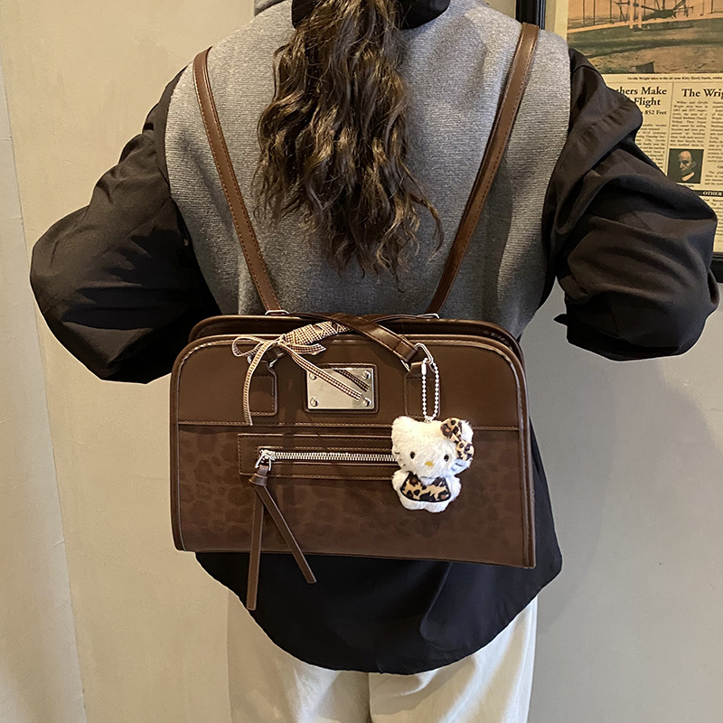 Retro leopardo hombro bajo la braza, la versión coreana de la mochila casual Zhongqi 2025 nuevo bolso de mano