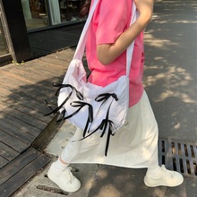 斜挎包女韩版新款可爱蝴蝶结大容量轻便单肩包学生通勤包上课书包