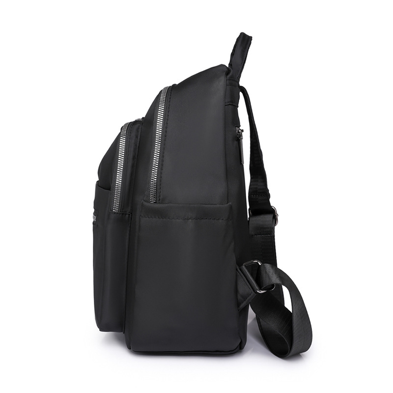 Transfronterizo al por mayor 2023 nueva mochila de nailon para mujer coreana simple y versátil mochila de viaje anti-salpicaduras de agua mochila escolar