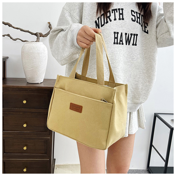 New wholesale fashionable and high-quality canvas handbag, simple and portable, easy to carry for going out, versatile lunch box and bento bag undefined
