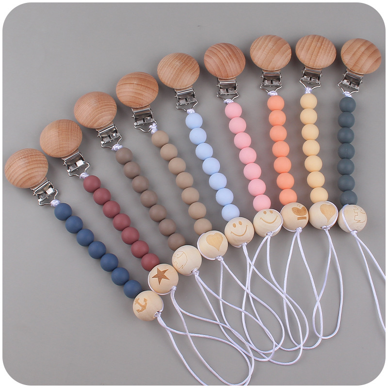 Nuevos suministros para bebés clip de chupete de haya creativo bebé DIY patrón de dibujos animados cuentas de madera Cadena de chupete cadena anti-caída