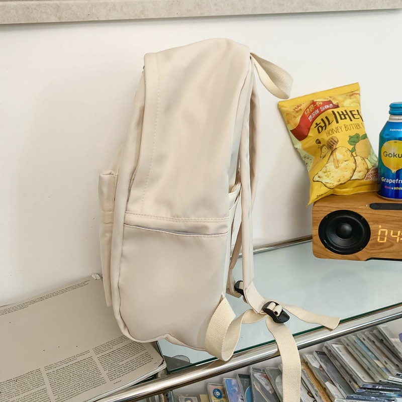 Venta al por mayor transfronteriza 2023 nueva mochila de pareja literaria de nailon simple y versátil mochila de escuela para estudiantes de gran capacidad