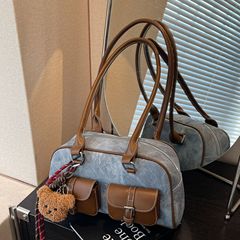 高級感のあるトートのカバンの女性2025の新型の潮は色のショルダーバッグの大容量にぶつかります。