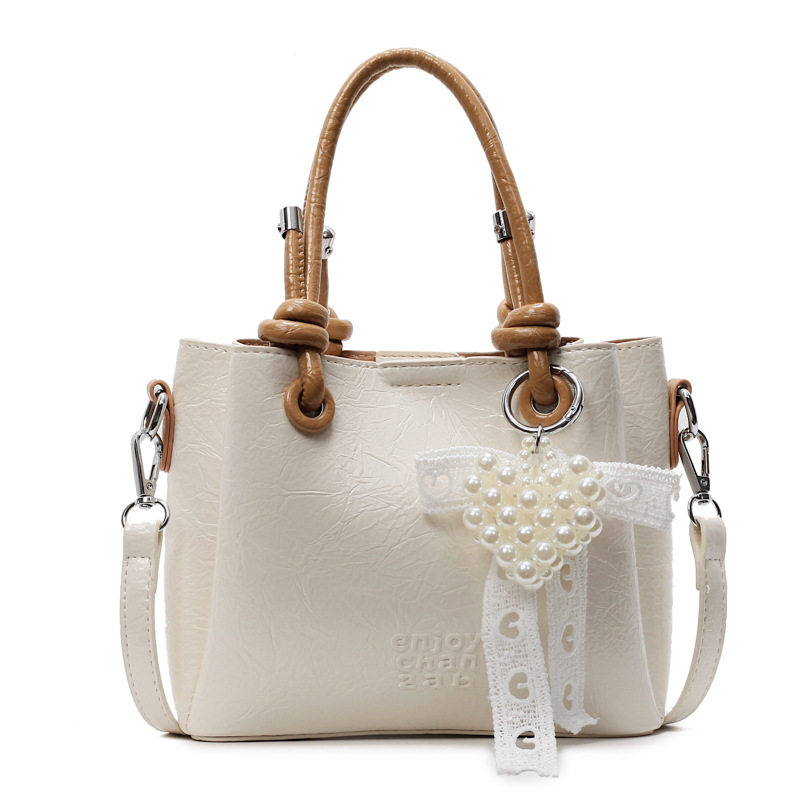 Bolso de mano de tendencia de comercio exterior femenino 2025 nuevo estilo plisado todo-fósforo bolso de hombro retro de alta gama ocio cubo bolso