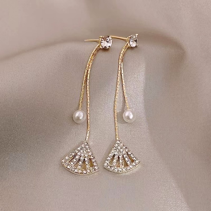 Fashionable elegant long earrings from pearl with tassels