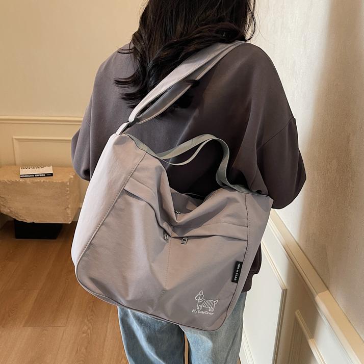 Bolso tote de lona de gran capacidad explosivo transfronterizo 2025 nuevo estilo de clase bolso de mensajero de ocio bolso de viaje femenino