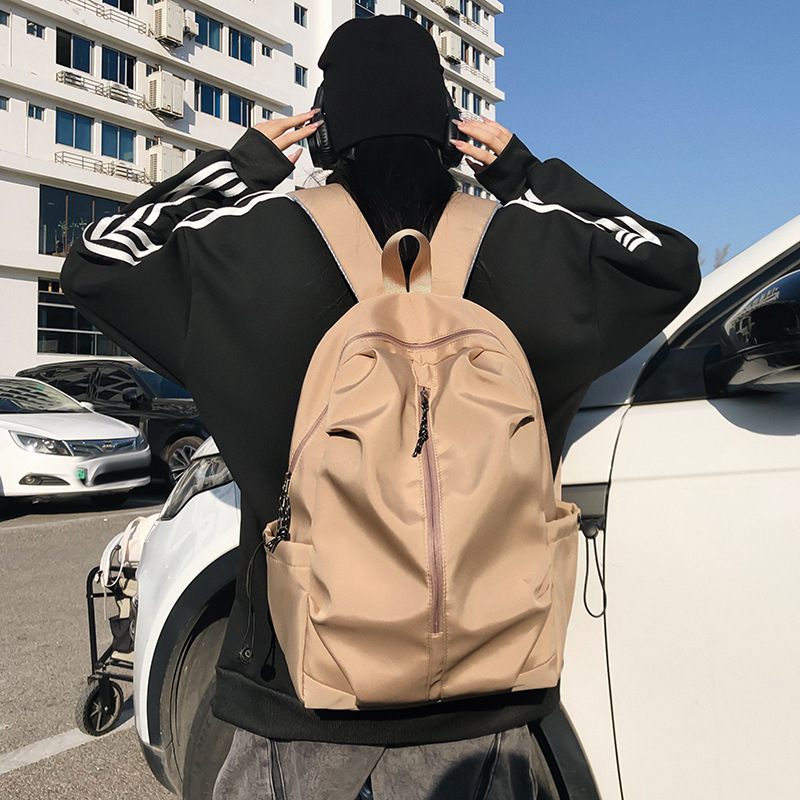 Lightweight travel bag simple casual backpack male fashion large capacity backpack summer high school students solid color
