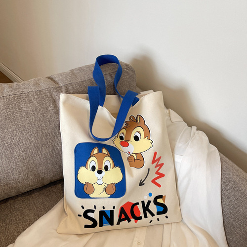 Original niche canvas bag for women, new cartoon Donald Duck hand-held tote bag for college students, reading single-shoulder cross-border