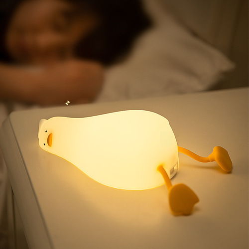 Flatlying Duck Small Night Light, Tap Tap Silicone LED Turning Duck Charging Bedside Companion Sleep Phone Stand Night Light Creative