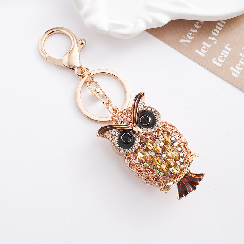 Europa y América creativa transfronteriza estilo hueco búho llavero de metal con diamantes bolsos de automóviles para animales colgantes de regalo