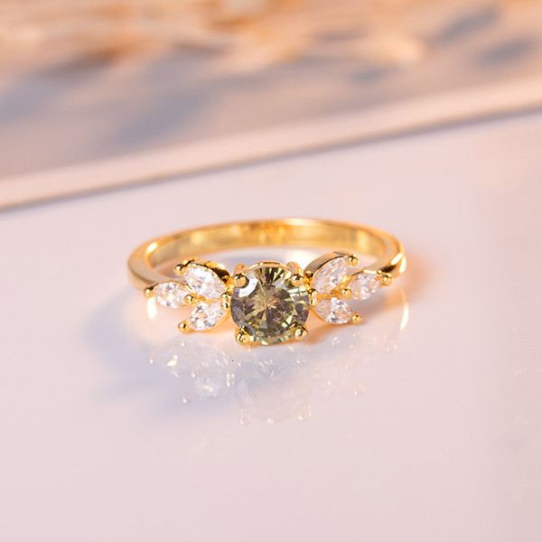 Golden ring with zircon