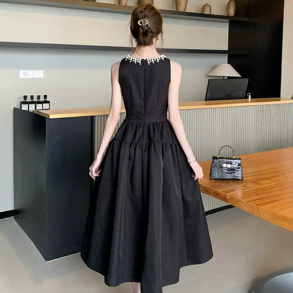 Europa estación chaleco negro vestido de mujer verano lujoso ligero Hepburn vestido de noche con perlas de estilo de alto rendimiento vestido largo