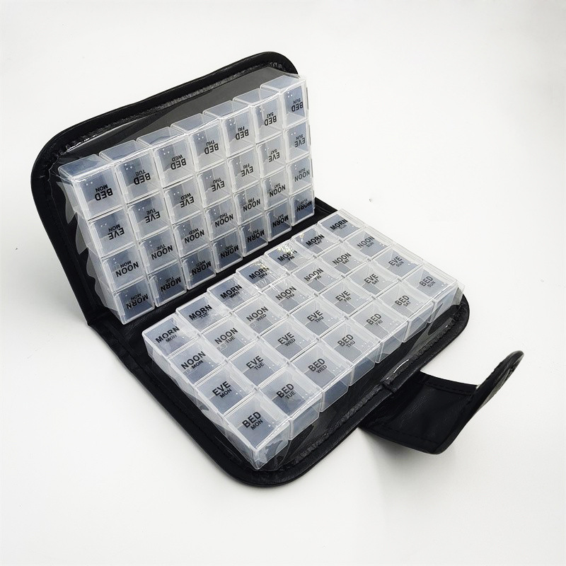 Amazon bolsa de cuero billetera caja de la píldora siete días de gran capacidad portátil caja de la píldora 56 rejilla de color caja de almacenamiento