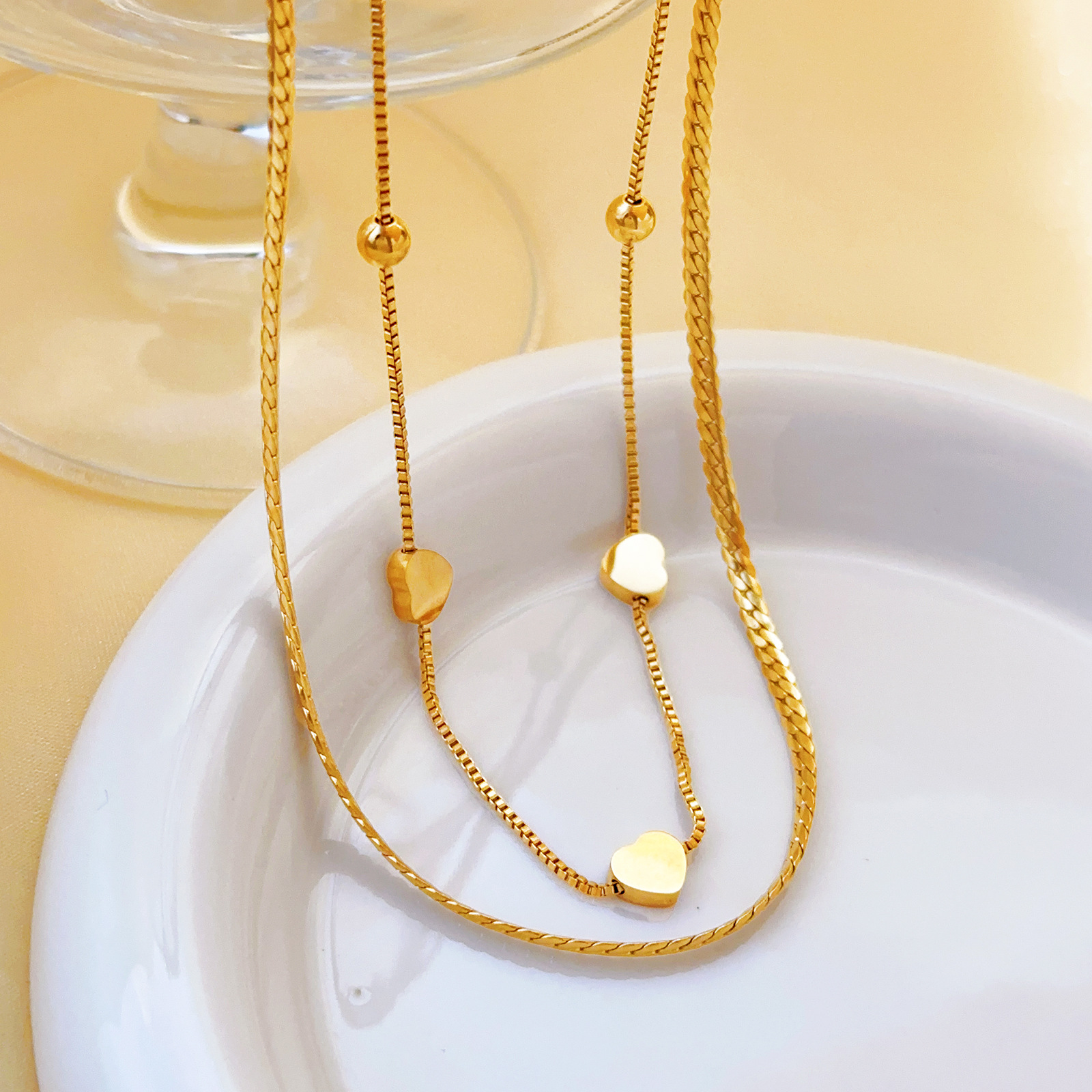 Europa y los Estados Unidos personalidad simplificada collar de hueso de serpiente joyas temperamento amor diseño colgante de acero de titanio conjunto de joyas para mujeres