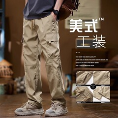 シャツの少ない服装のズボンの夏のアメリカのゆるいストレートの新型の多ポケットの青少年のズボンの男性のカジュアルなズボン