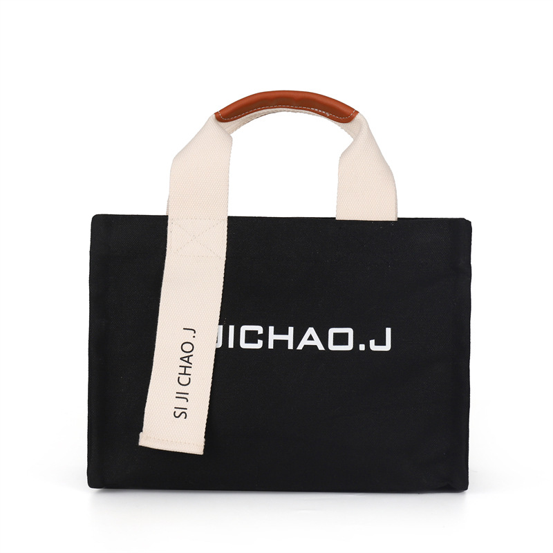 Bolsa personalizada al por mayor, bolso de mano retro de moda, estilo coreano nuevo, bolso de mano con letras impresas en color sólido para mujer