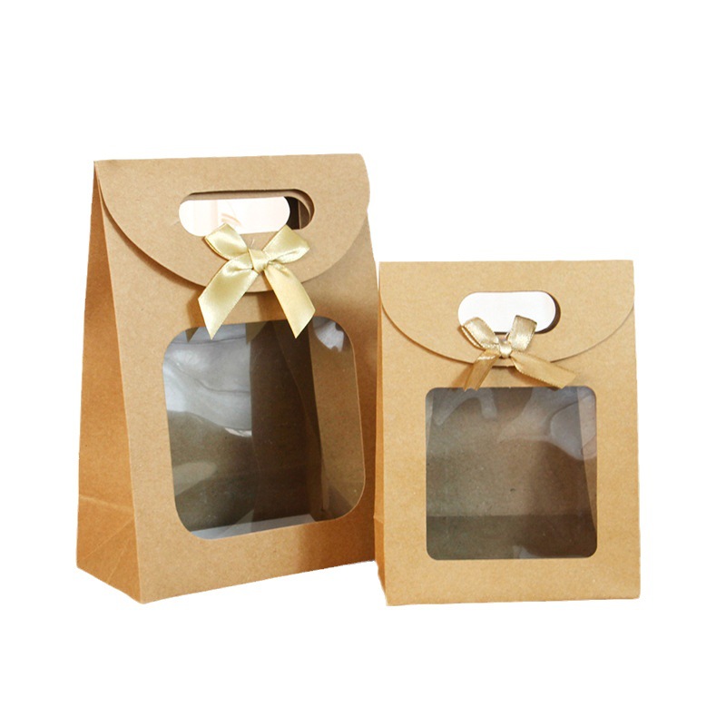 Bolsa de embalaje transparente de la ventana del arco del tirón en stock bolso al por mayor bolsa de papel de embalaje de regalo bolsa de regalo grande