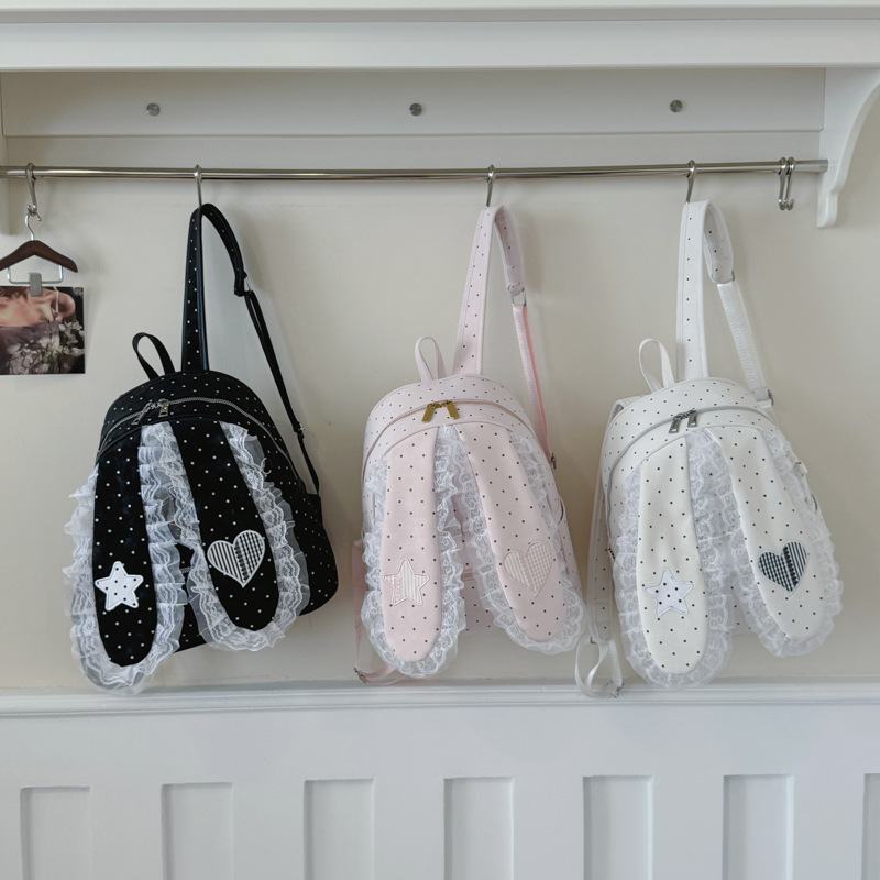 2026 nuevo punto de onda oreja de conejo mochila de moda mujer bolso de hombro universal portátil ligero bolso de encaje dulce