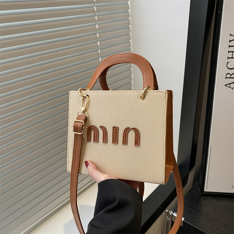 Bolso de mano de moda al por mayor color contraste bolso de mujer 2025 verano nueva letra de lujo bolso de hombro de viaje mochila