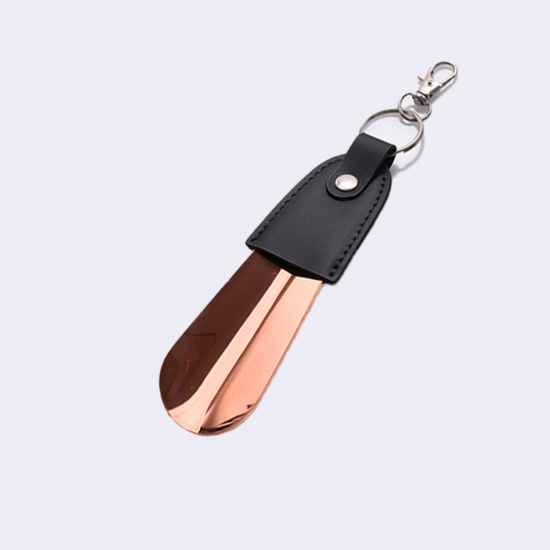 En stock suministro de acero inoxidable hebilla de llave tirador de zapatos con cubierta de cuero tirador de zapatos llave del coche colgante fácil de llevar levantador de zapatos