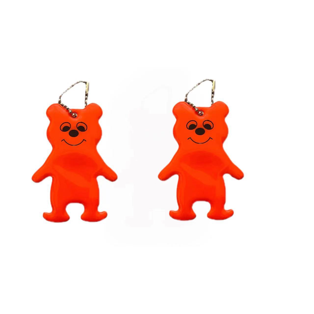 Fabricantes de procesamiento de colgantes reflectantes modelado oso colgantes reflectantes PVC llavero colgante