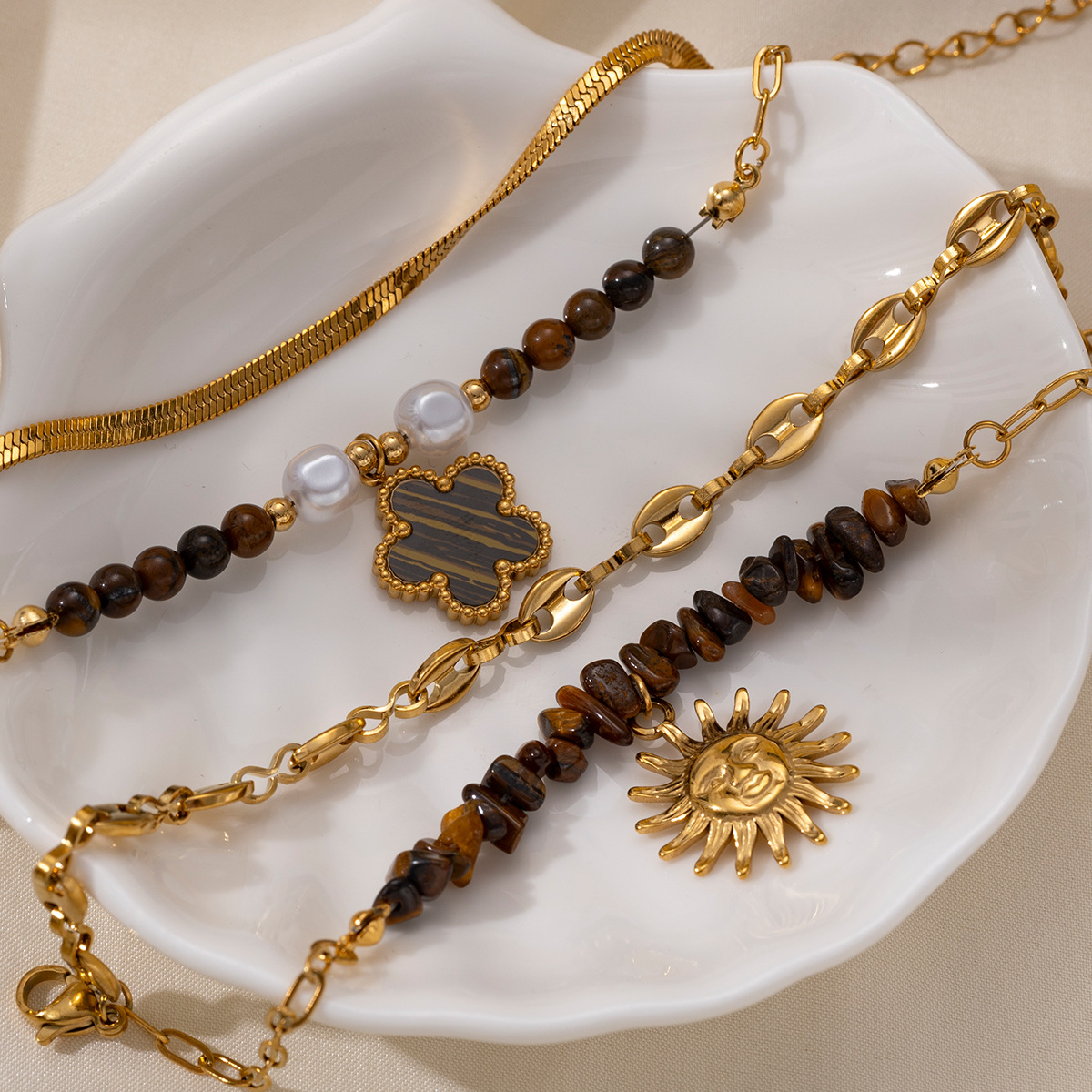 Tina Europa y los Estados Unidos pulsera de acero inoxidable nicho de cuatro hojas de sol cadena cubana cadena de hueso de serpiente cruzada fronteriza joyería de mano caliente mujer
