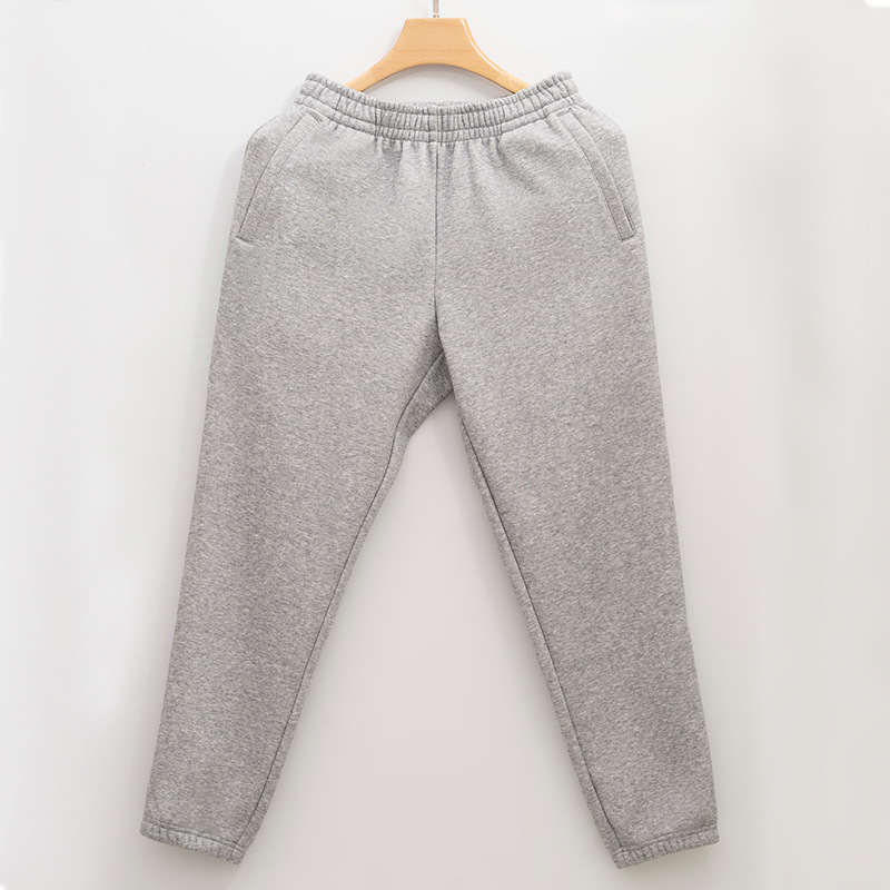 Nueva cremallera bolsa de lana forrado pantalones de chándal de los hombres y las mujeres otoño y el invierno suelto nuevo tobillo-atado de algodón casual espesado caliente pantalones hombres