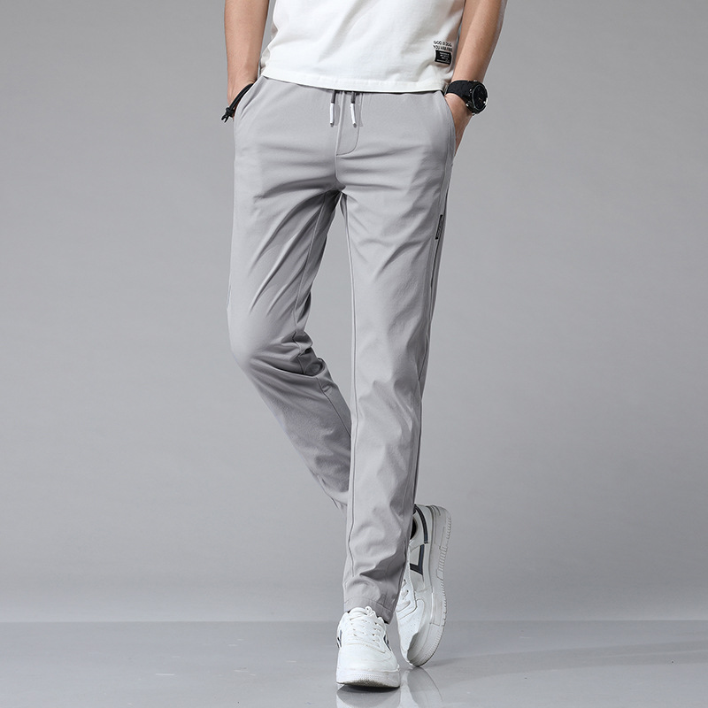 Pantalones casuales de hielo delgados de verano transfronterizos elásticos delgados de hombre 2026 nuevos pantalones deportivos de secado rápido
