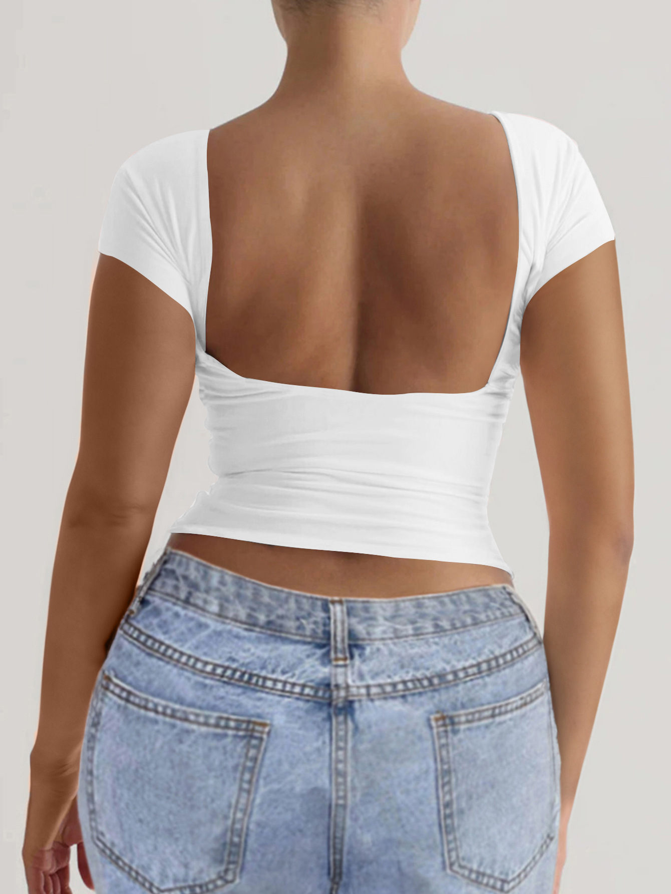 91g Weight Short Sleeve Sleeve Length Pullovers Placket Type Regular Sleeve Sleeve Type Spandex, Viscose fiber Fabric Type Regular Top Length T-shirt Tops Type Daily Occasion Round Neck Neckline Comfort Function Slim Fit Type Solid Color Pattern 2025 Spring and Summer Season Women's Gender Backless Design Streetwear Style Wholesale Women's Streetwear Solid Color Short Sleeve Backless T-Shirts 2