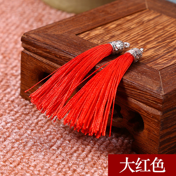 Metal earrings with tassels