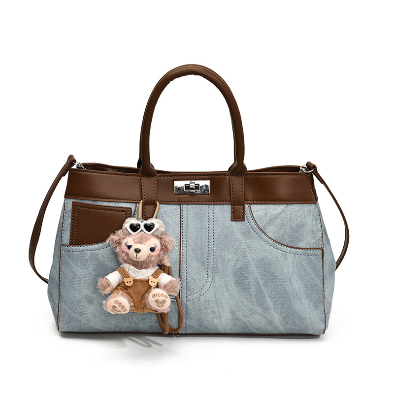 Bolso de mano retro de otoño y invierno para mujeres 2025 nuevo estilo de alta calidad de la bolsa de transporte de viaje empalmado bolso de hombro