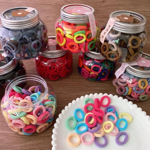 100 cans of candy-colored basic small children's finger towel rings that do not hurt hair and are versatile for girls to braid.