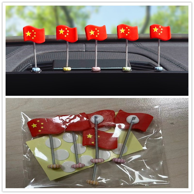 かわいい車の国旗の装飾は首を横に振って赤い旗を飾って自動車の装飾用品の助手席のバックミラーの車内の装飾品を並べます。|undefined