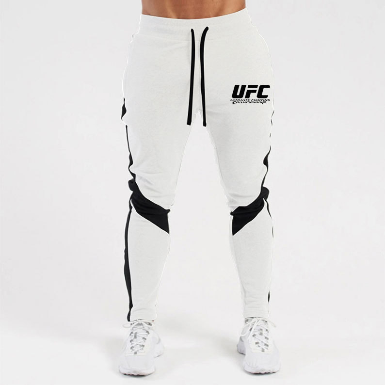 Otoño e invierno letras deportivas juventud ordinaria media elástica Mediados de cintura pantalones de algodón negro en stock moda de lana pantalones de los hombres