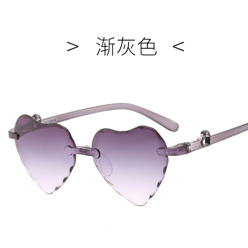 Nuevo gradiente colorido de dibujos animados amor gafas de sol para niños 62001 sin marco recorte melocotón corazón gafas de sol para niños al por mayor